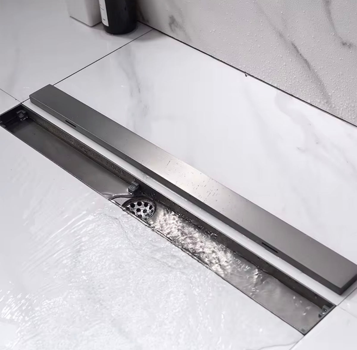 Linear Shower Drain Matte Black - Detail shot of grate